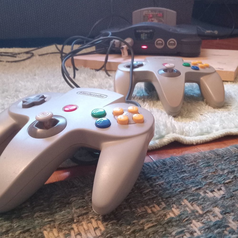 Nintendo 64, two controllers and one Mario Kart 64 game
